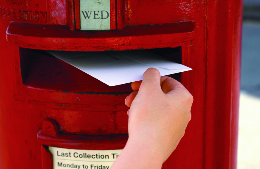 Voter posting their Postal Vote